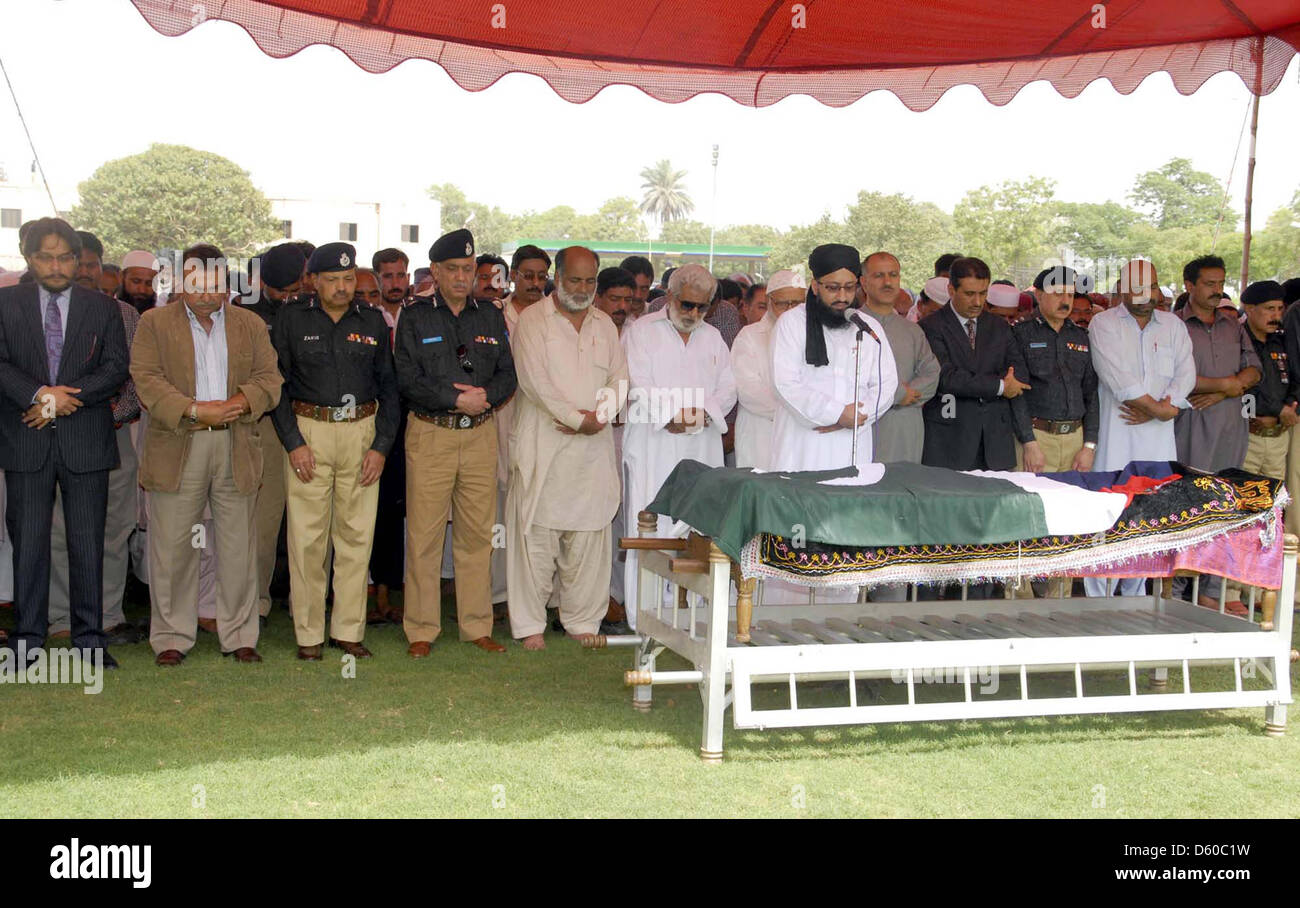 KARACHI, PAKISTAN, APR 10: Sindh Police Inspector General (IG), Shahid Nadeem Baloch  and other senior police officials funeral prayer of Shaheed Inspector Agha Asadullah, who was  gunned down by unidentified persons in Saddar locality last night, at Police Garden Headquarter  in Karachi on Wednesday, April 10, 2013. (PPI Images). Stock Photo