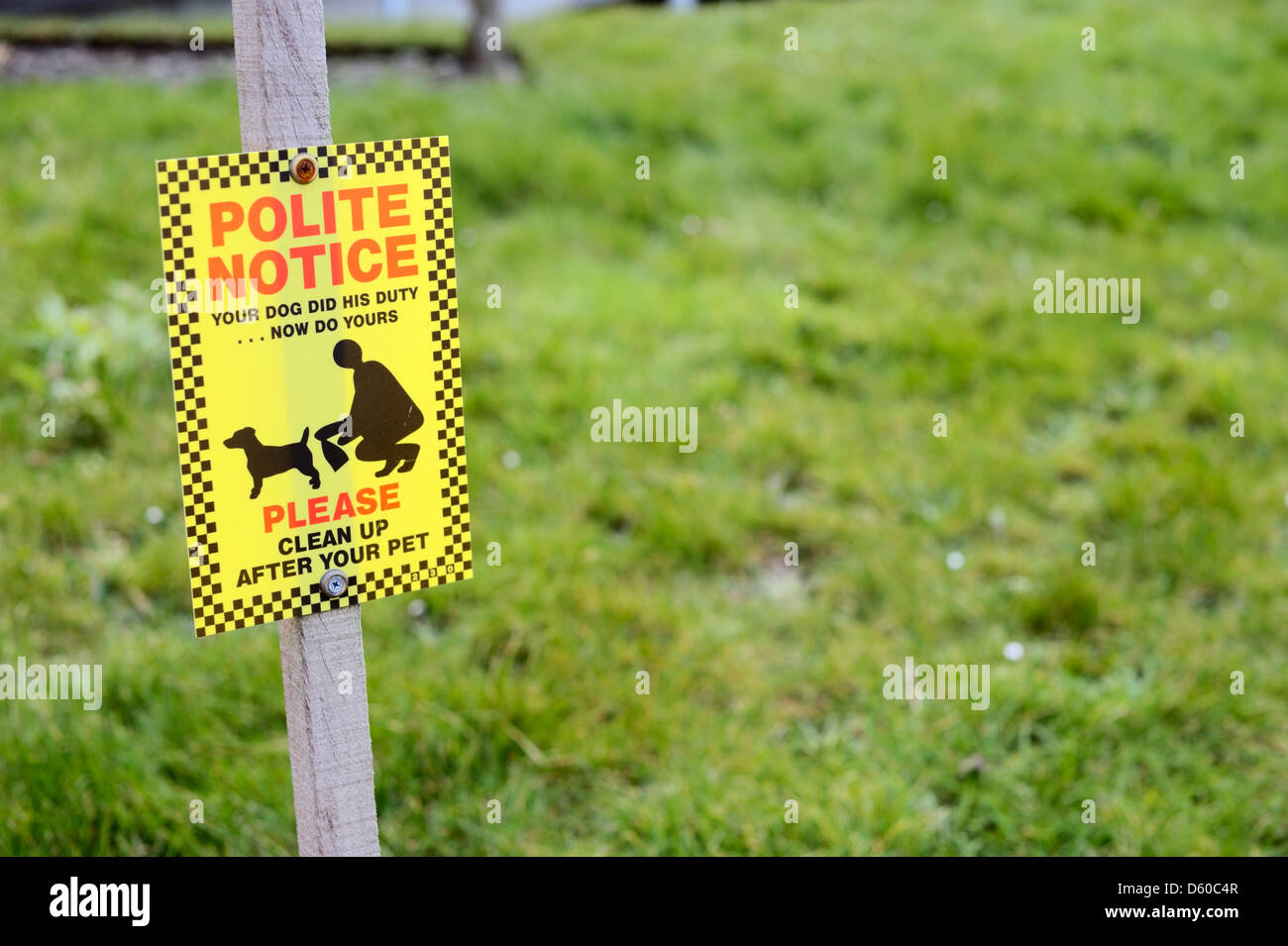 Polite notice requesting the clearing up of dog waste, Wales, UK. Stock Photo