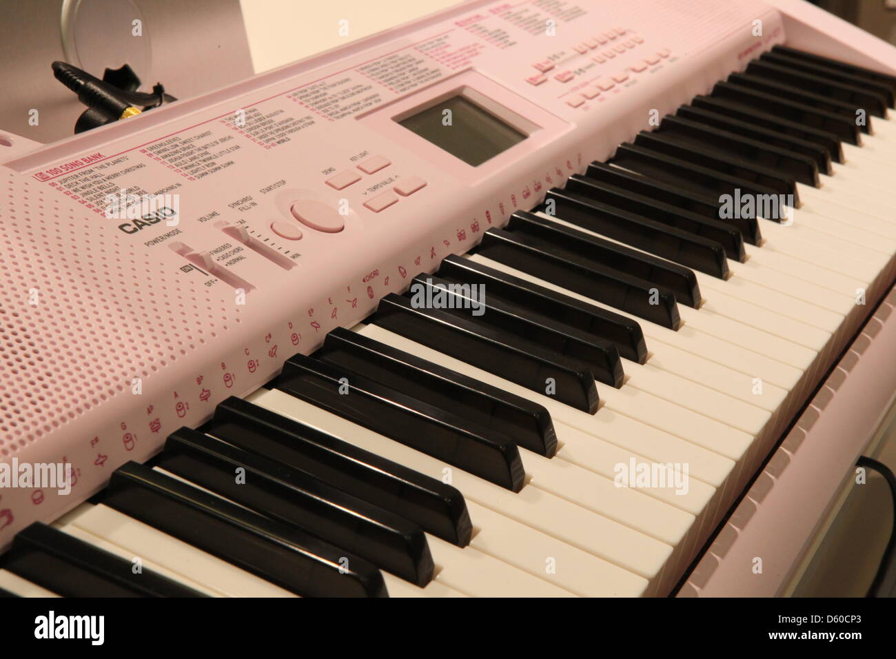 A pink-coloured keyboard of Casio is on display the music trade fair in Frankfurt Main, Germany, 10 April 2013. Photo: Susannah V. Vergau Stock Photo - Alamy