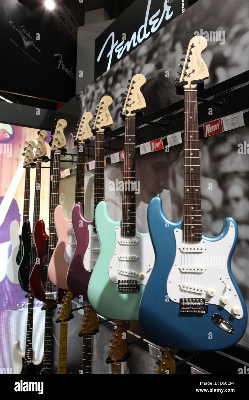 Fender guitars in pastel shades are on display at the music trade fair
