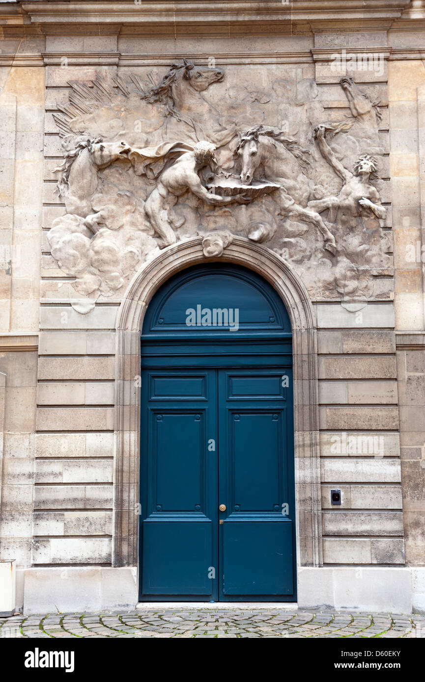 Horses of Apollo sculpture by Robert Le Lorrain on the stables of the Hotel Rohan, Paris, France Stock Photo