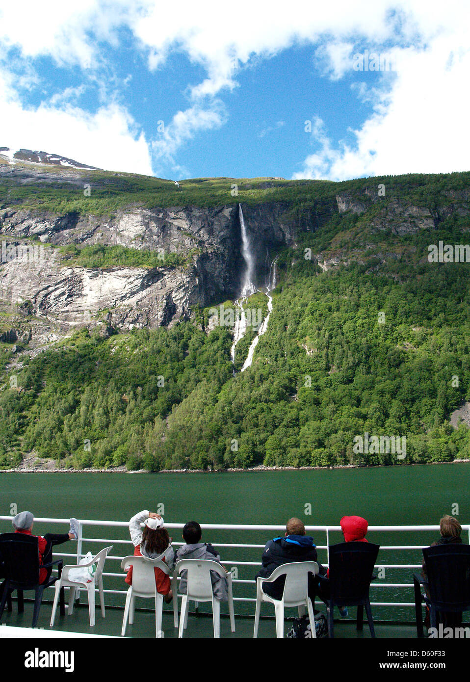 Passengers aboard the ferry from Hellesylt to Geiranger viewing the waterfalls of the Geiranger