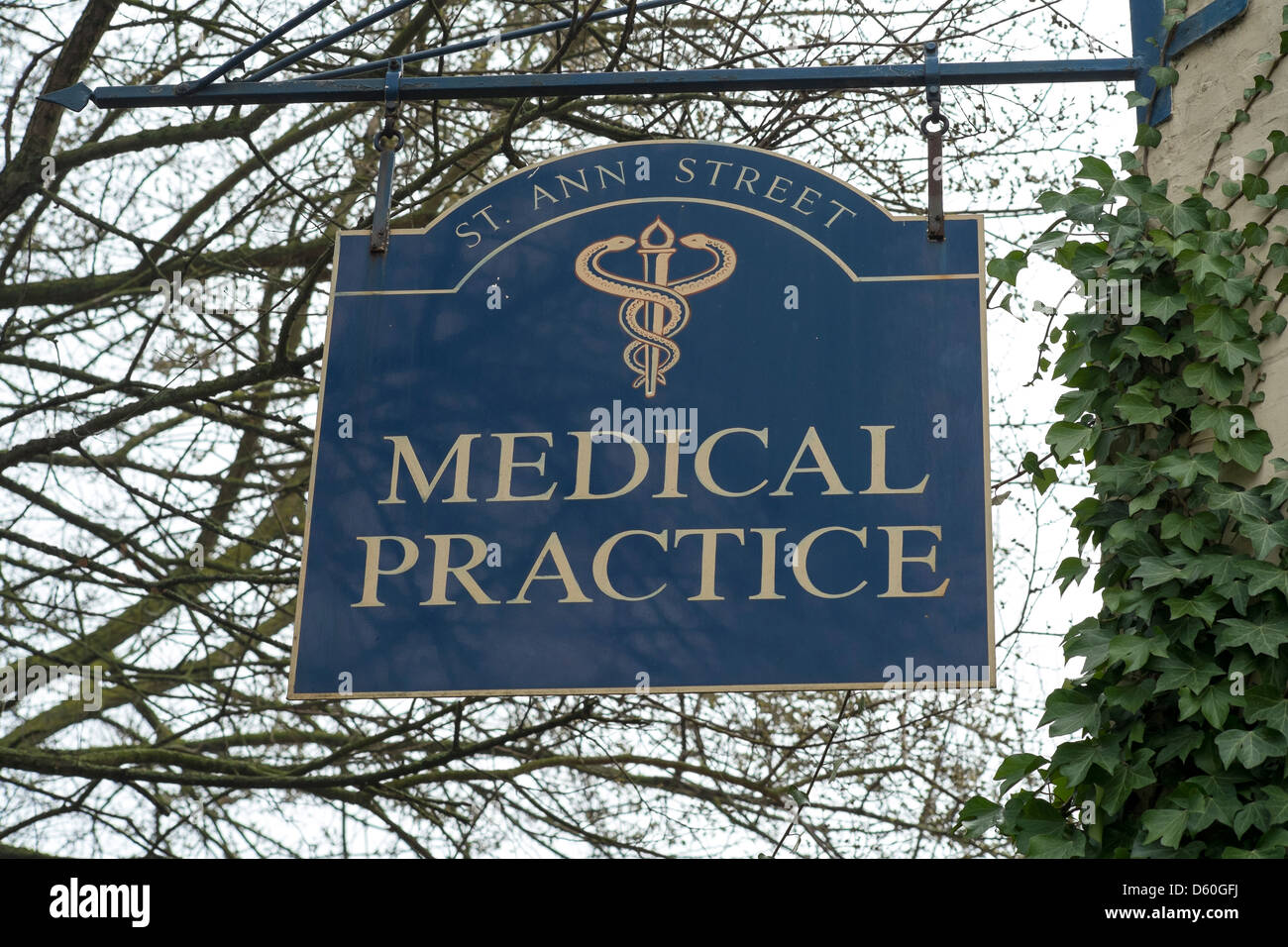 Looking up at UK medical practice doctors surgery sign Stock Photo - Alamy