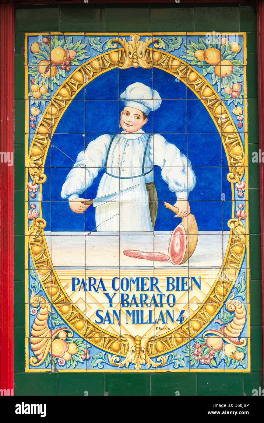 Para Comer Bien y Barato, San Millan 4, colourful ceramic wall tiles outside bar and restaurant, La Latina, Madrid, Spain Stock Photo