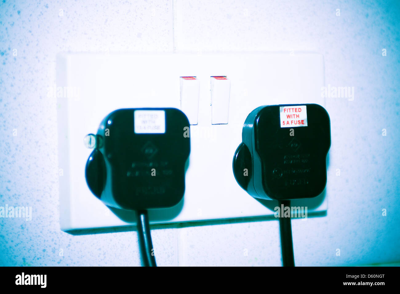 Plugs in double wall socket Stock Photo