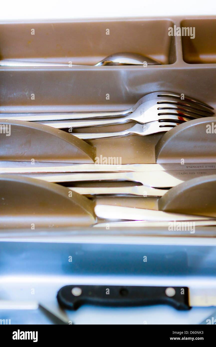 Stainless steel cutlery in trays in drawer Stock Photo Alamy