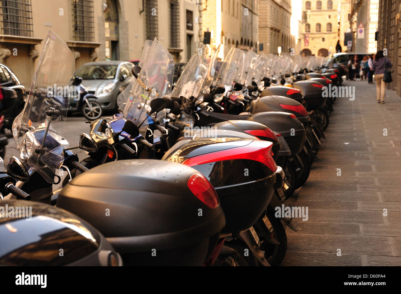 Scooters parked in Rome Italy side street. Scooter storage box,straight line,roadside parking Stock Photo