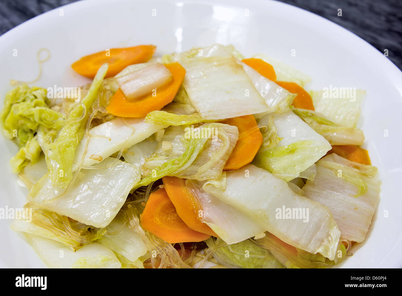 Stir Fry Chinese Cabbage with Garlic Sliced Carrots and Clear Bean Thread Noodles Dish Closeup Stock Photo