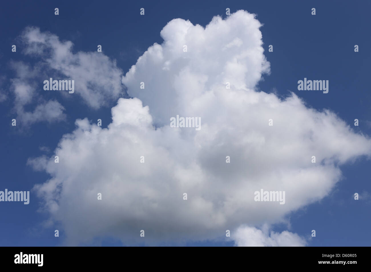 a cumulus cloud developing into cumulonimbus Stock Photo