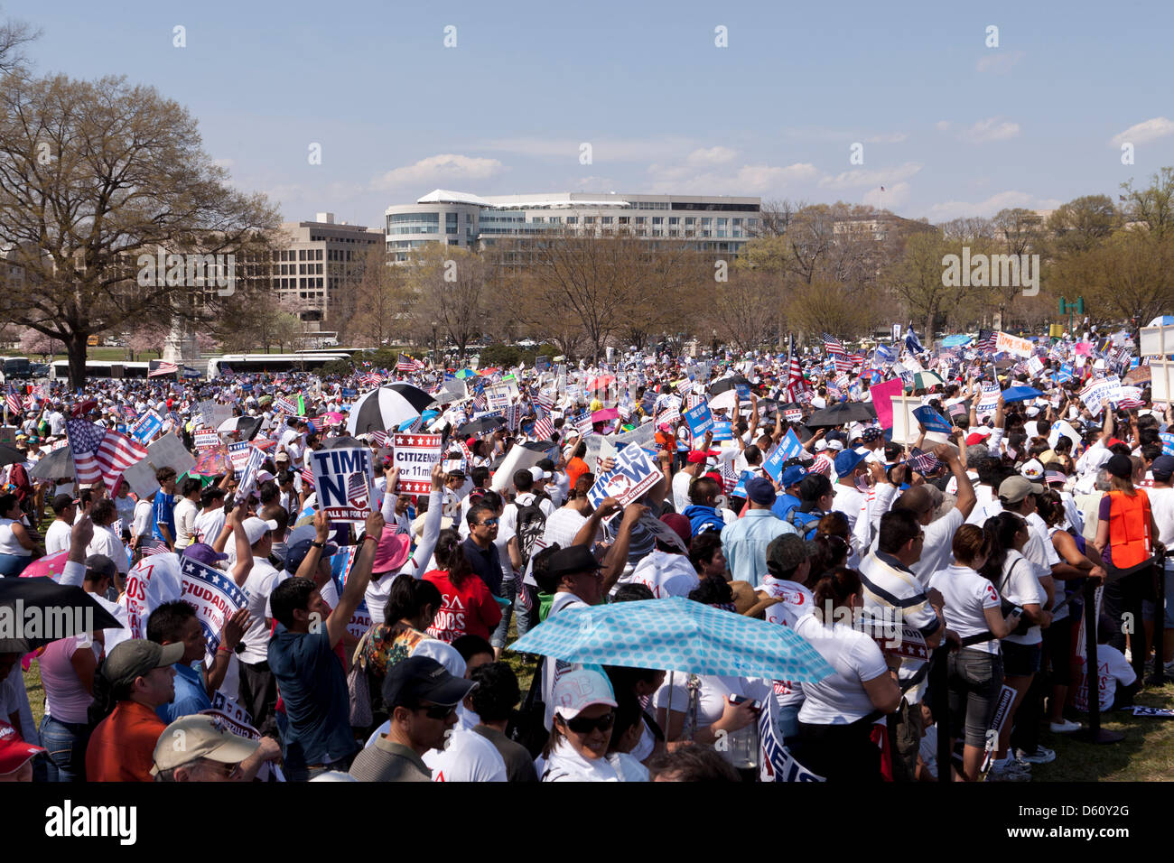 Large crowd waving Mexican and American flags at an immigration reform  rally in Washington DC Stock Photo