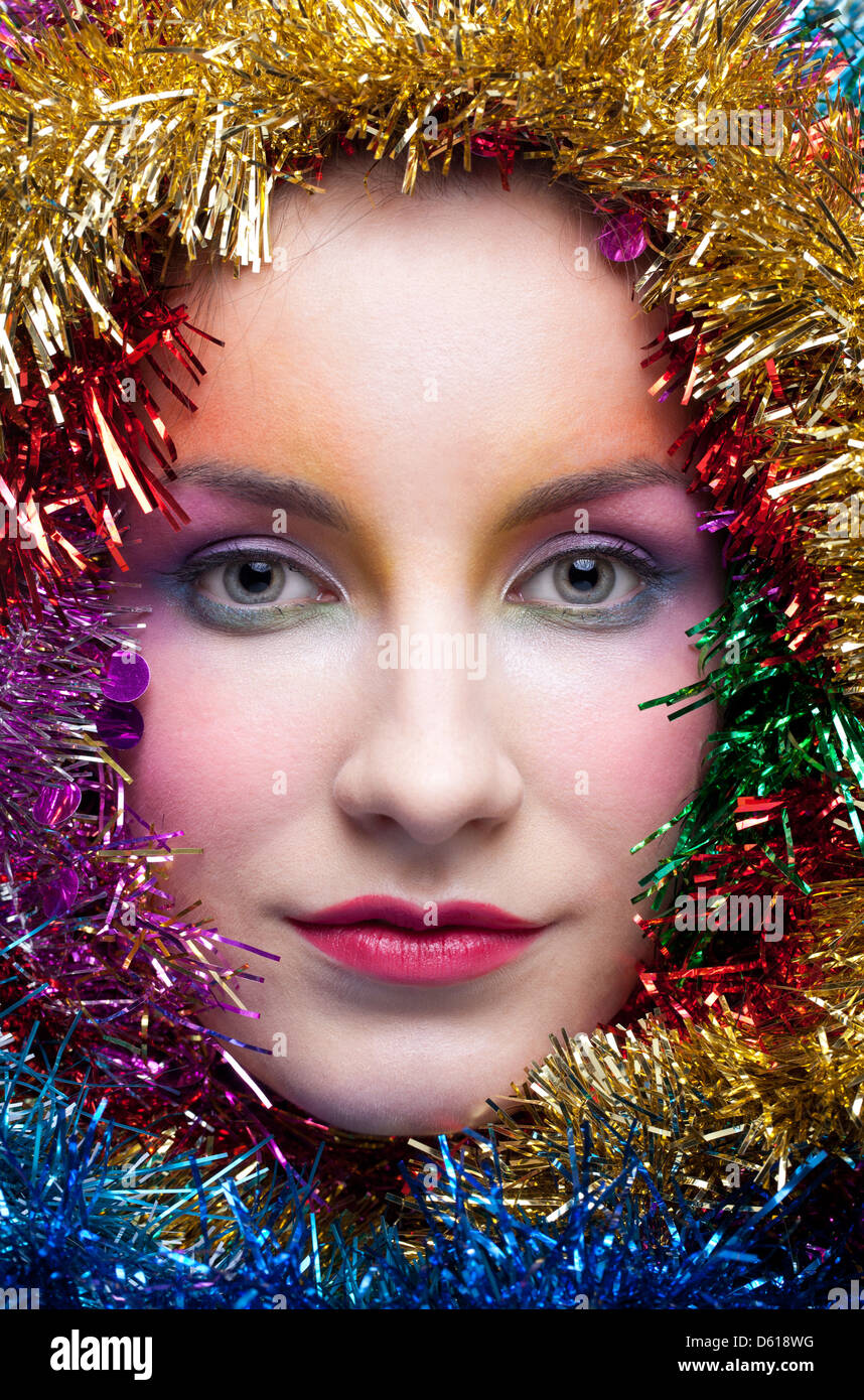 Woman in tinsel Christmas costume Stock Photo