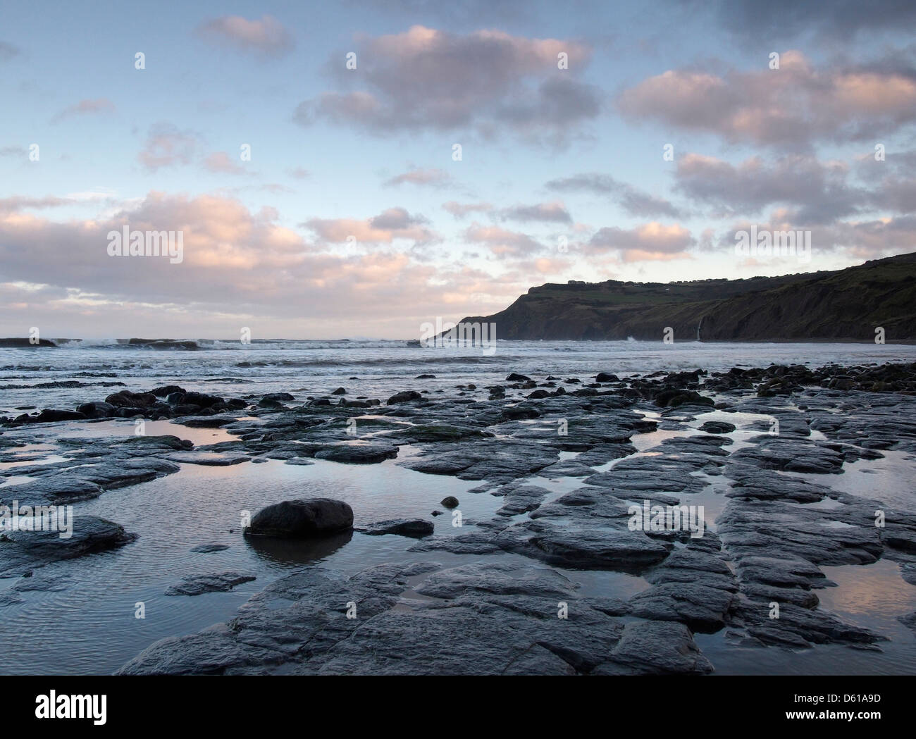 Sunset clouds on beach, Boggle hole, Yorkshire, England Stock Photo - Alamy