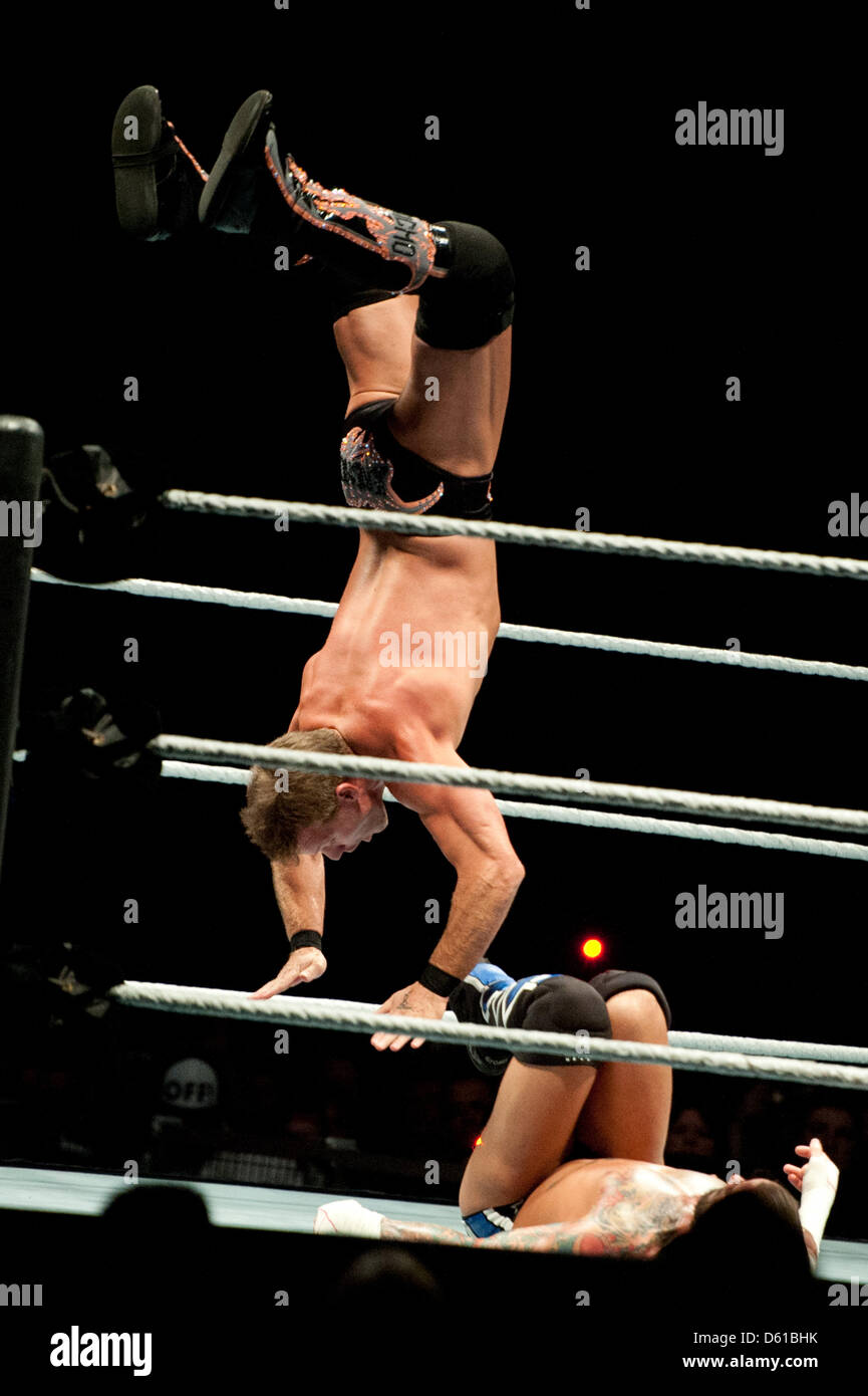 Canadian-wrestler Chris Jericho (L) performs a jump during a fight with US-wrestler CM Punk during the RAW WrestleMania Revenge Tour at the o2 World canue in Berlin, Germany, 14 April 2012. The WWE (World Wrestling Entertainment) celebrates its 20th German anniversary this April. The first show in Germany was staged in Kiel, Germany, in April 1992. Photo: Sebastian Kahnert Stock Photo