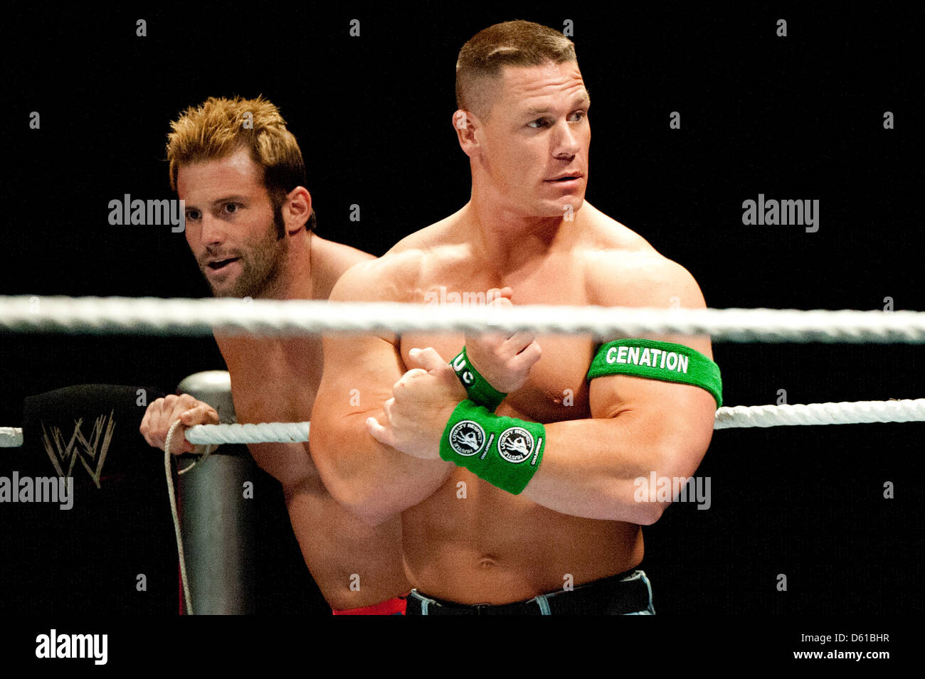 US-wrestler John Cena (R) holds on to the ropes of the wrestling ring as he stands next to US-wrestler Zack Ryder during a fight in the RAW WrestleMania Revenge Tour at the o2 World canue in Berlin, Germany, 14 April 2012. The WWE (World Wrestling Entertainment) celebrates its 20th German anniversary this April. The first show in Germany was staged in Kiel, Germany, in April 1992.  Stock Photo