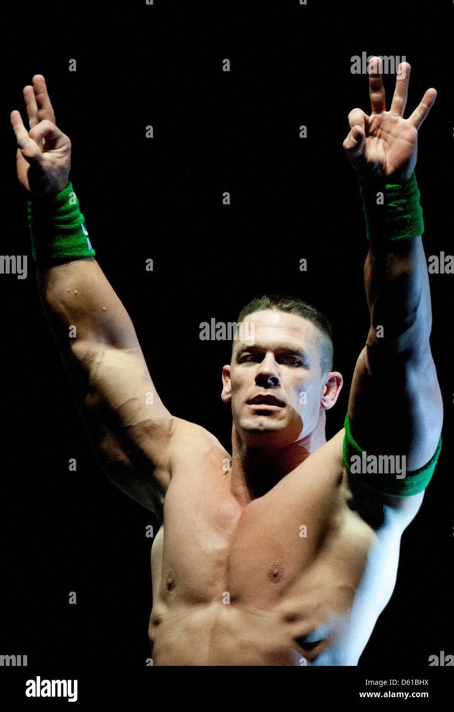 US-wrestler John Cena cheers during a fight at the RAW WrestleMania Revenge Tour at the o2 World canue in Berlin, Germany, 14 April 2012. The WWE (World Wrestling Entertainment) celebrates its 20th German anniversary this April. The first show in Germany was staged in Kiel, Germany, in April 1992. Photo: Sebastian Kahnert Stock Photo