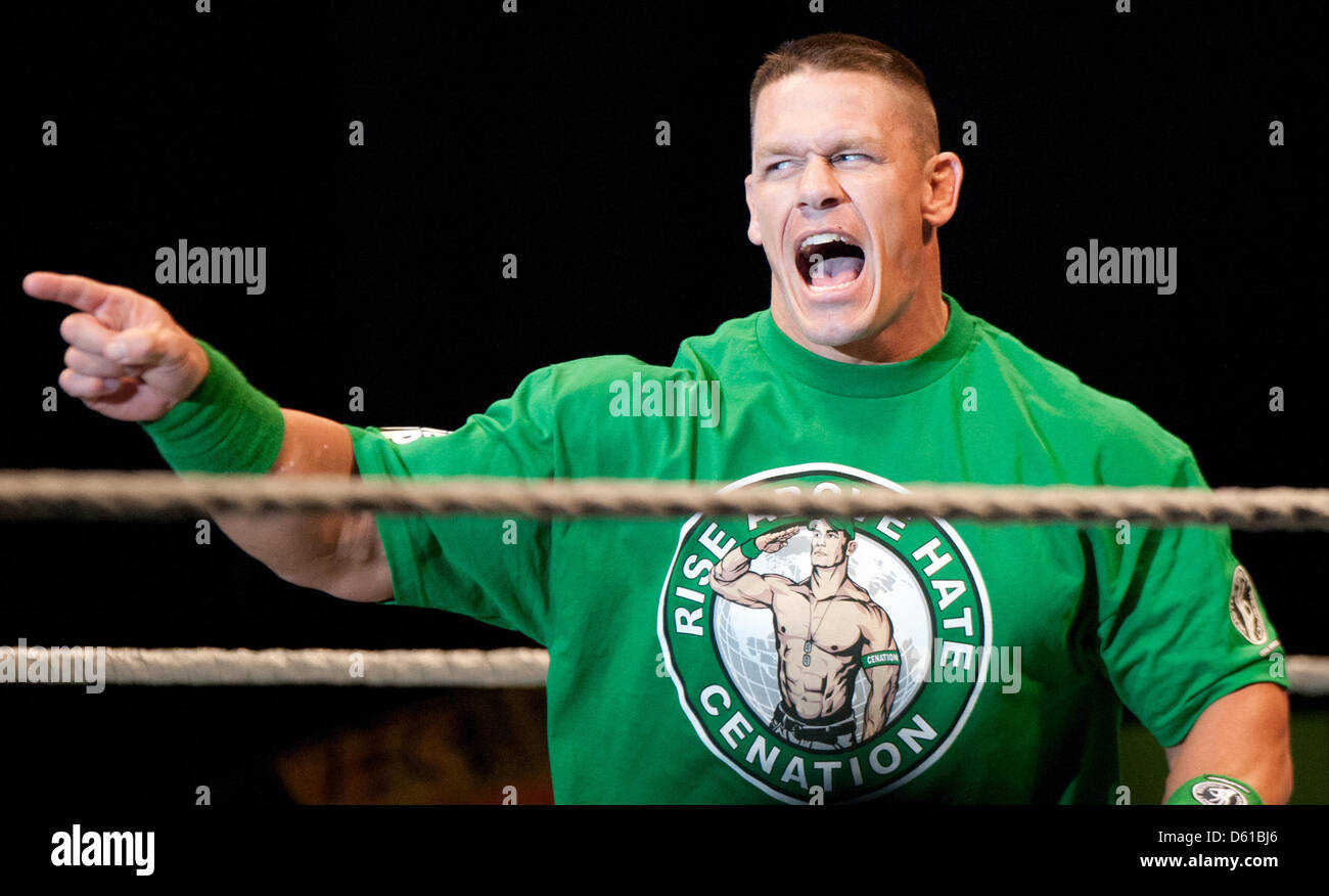 US-wrestler John Cena points at his contenders prior to a fight at the RAW WrestleMania Revenge Tour at the o2 World canue in Berlin, Germany, 14 April 2012. The WWE (World Wrestling Entertainment) celebrates its 20th German anniversary this April. The first show in Germany was staged in Kiel, Germany, in April 1992. Photo: Sebastian Kahnert Stock Photo