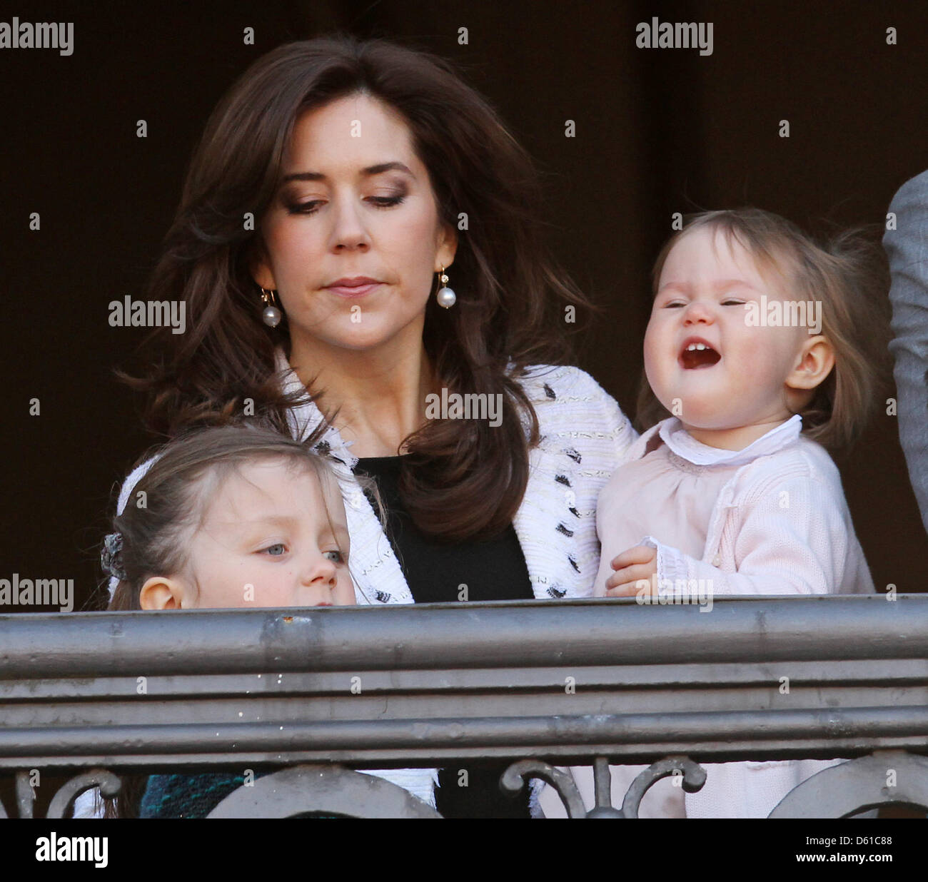 Danish Crown Princess Mary and her daughters Josephine (R) and Isabella (front) stand on the balcony of Amalienborg Palace to celebrate the 72nd birthday of Queen Margrethe in Copenhagen, Denmark, 16 April 2012. Photo: Patrick van Katwijk NETHERLANDS OUT Stock Photo
