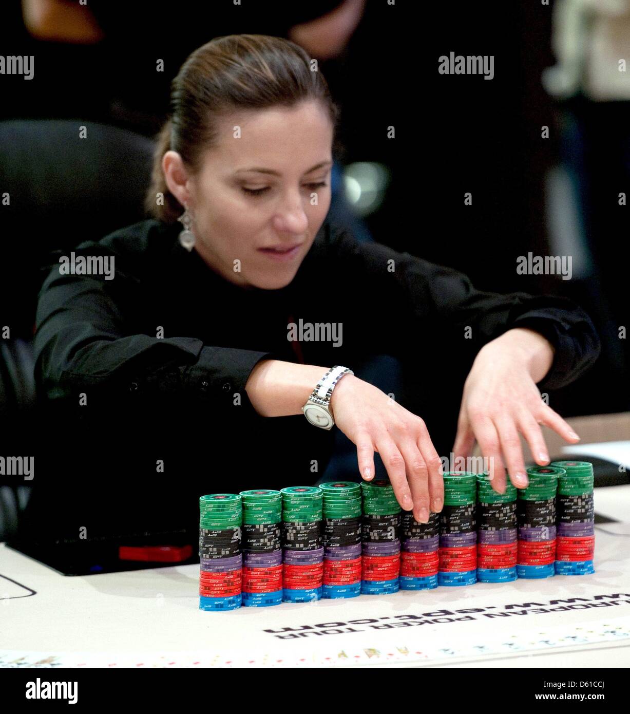A Croupier stacks chips during the European Poker Tour (EPT) at Grand Hyatt Hotel in Berlin, Germany, 16 April 2012. About 1,000 players participate in the tournament until 21 april 2012. Photo: ROBERT SCHLESINGER Stock Photo