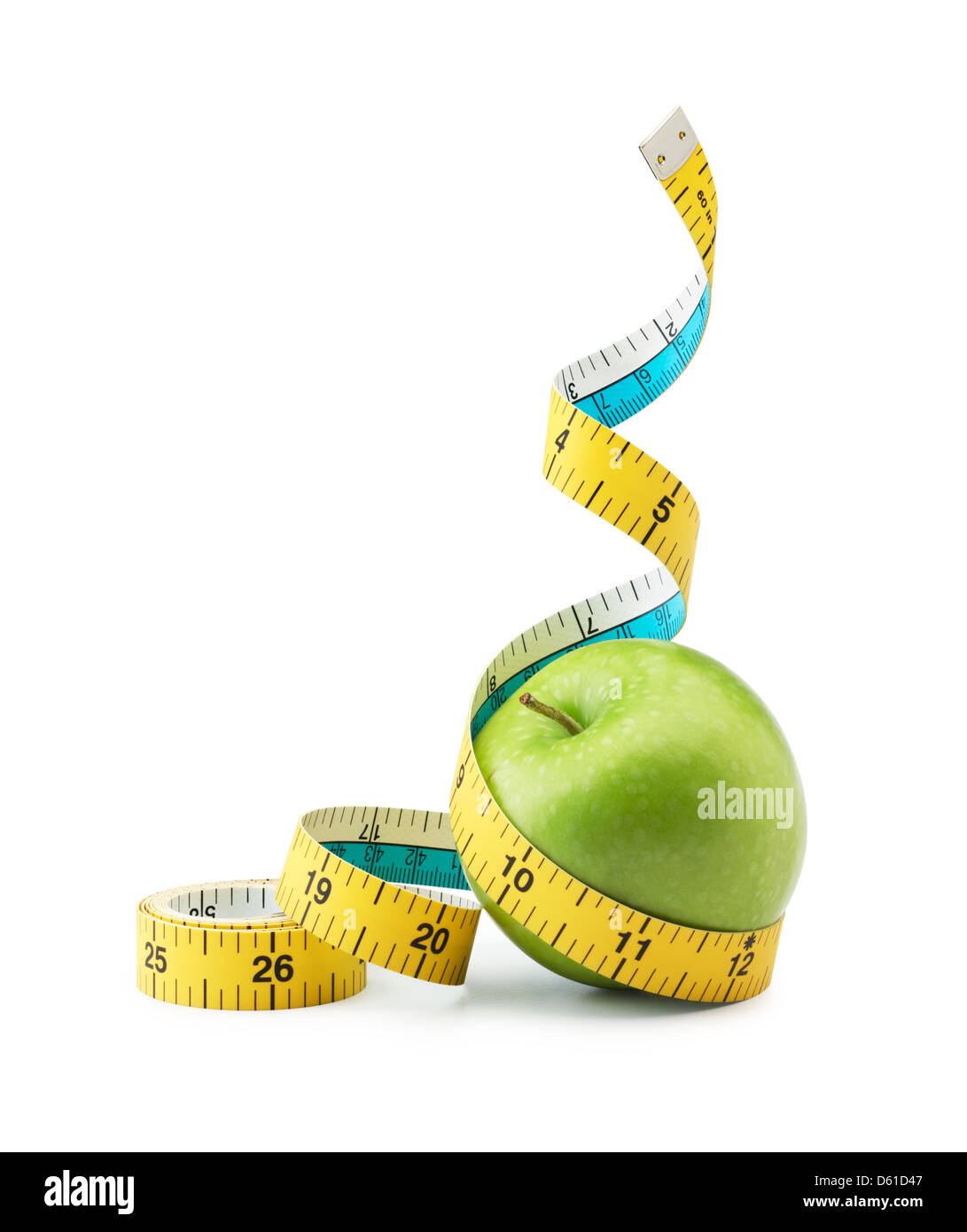 tape measure measuring green apple against white background Stock Photo