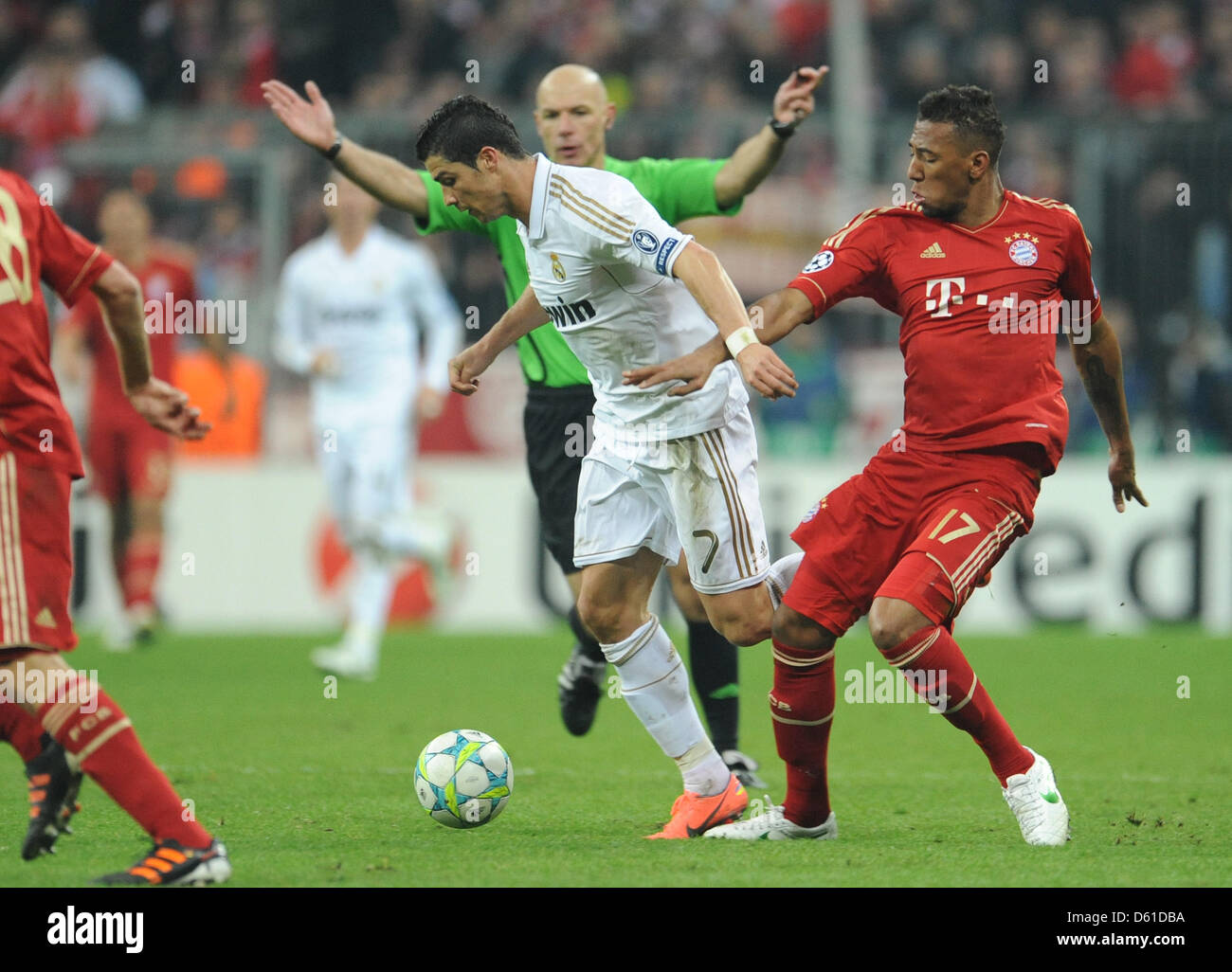 Munich's Cristiano Ronaldo (L) and Madrid's Jerome Boateng vie for the ball during the Champions League semi-final first leg soccer match between FC Bayern Munich and Real Madrid at the Allianz Arena in Munich, Germany, 17 April 2012. Photo: Andreas Gebert dpa/lby Stock Photo
