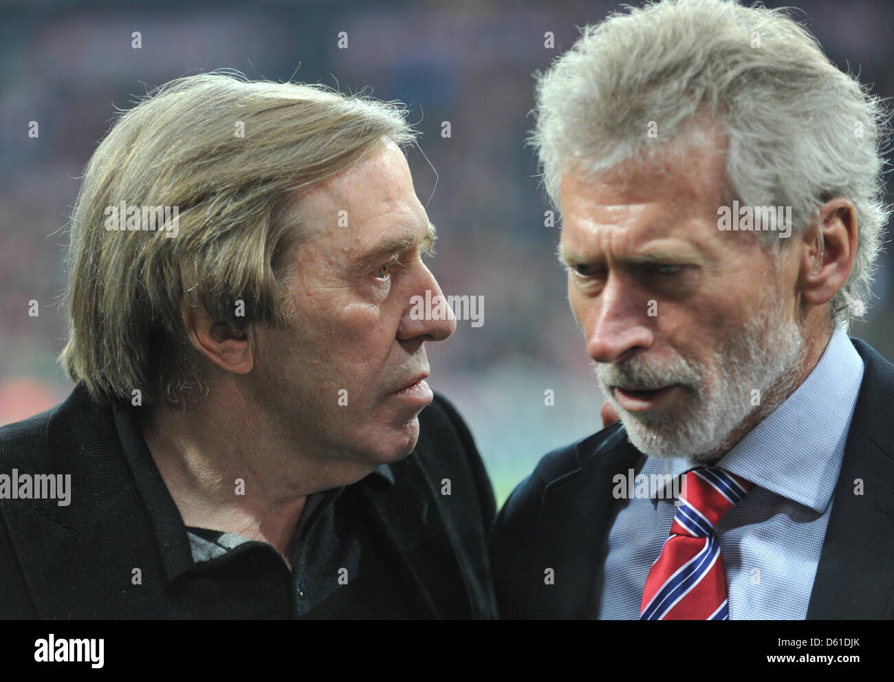 Former German soccer players Guenter Netzer (L) and Paul Breitner chat before the Champions League semi-final first leg soccer match between FC Bayern Munich and Real Madrid at the Allianz Arena in Munich, Germany, 17 April 2012. Photo: Andreas Gebert dpa/lby Stock Photo