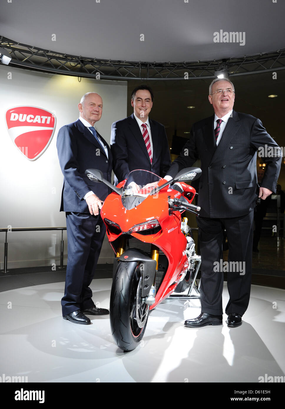 Chairman of the Volkswagen Managing Board Martin Winterkorn (R-L), Lower Saxonian Prime Minister David McAllister and chairman of Volkswagen Supervisory Board Ferdinand Piech stand next to a Ducati Panigale motorbike prior to the general meeting of car manufacturer  Volkswagen in Hamburg, Germany, 19 April 2012. Ursula Piech will be elected to the supervisory board during the meeti Stock Photo