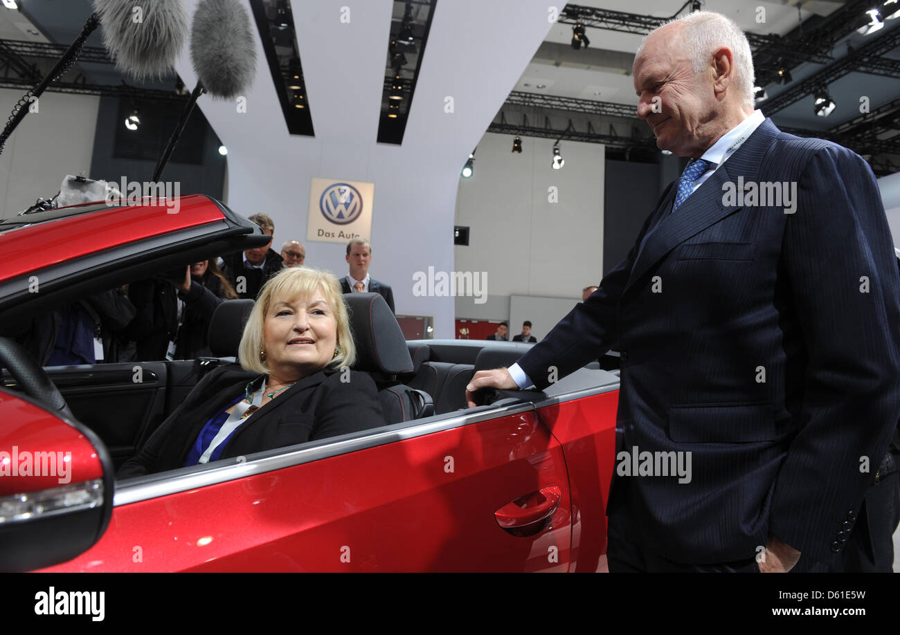 Chairman of Volkswagen Supervisory Board, Ferdinand Piech, stands next to his wife Ursula Piech sitting in a VW Golf convertible car during the general meeting of car manufacturer  Volkswagen in Hamburg, Germany, 19 April 2012. Ursula Piech will be elected to the supervisory board during the meeting. Photo: MARCUS BRANDT Stock Photo