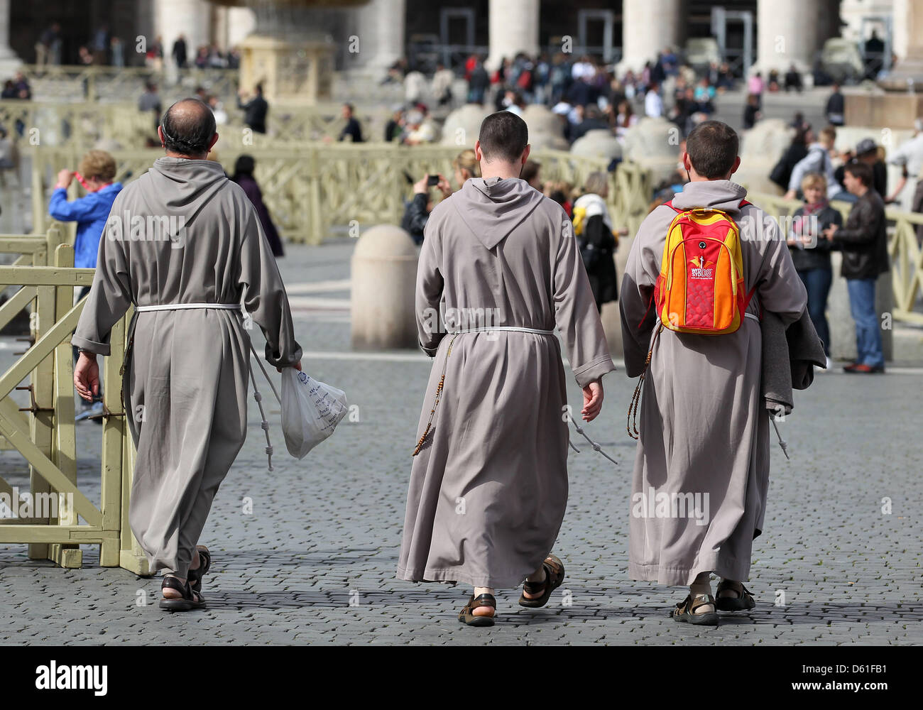Pilgrims walks across the St. Peter's Square in Rome, Germany, 19 April 2012. A mix of sun and rain with temperatures around 17 degrees Celsius are expected in the Italian capital city. Photo: Jan Woitas Stock Photo