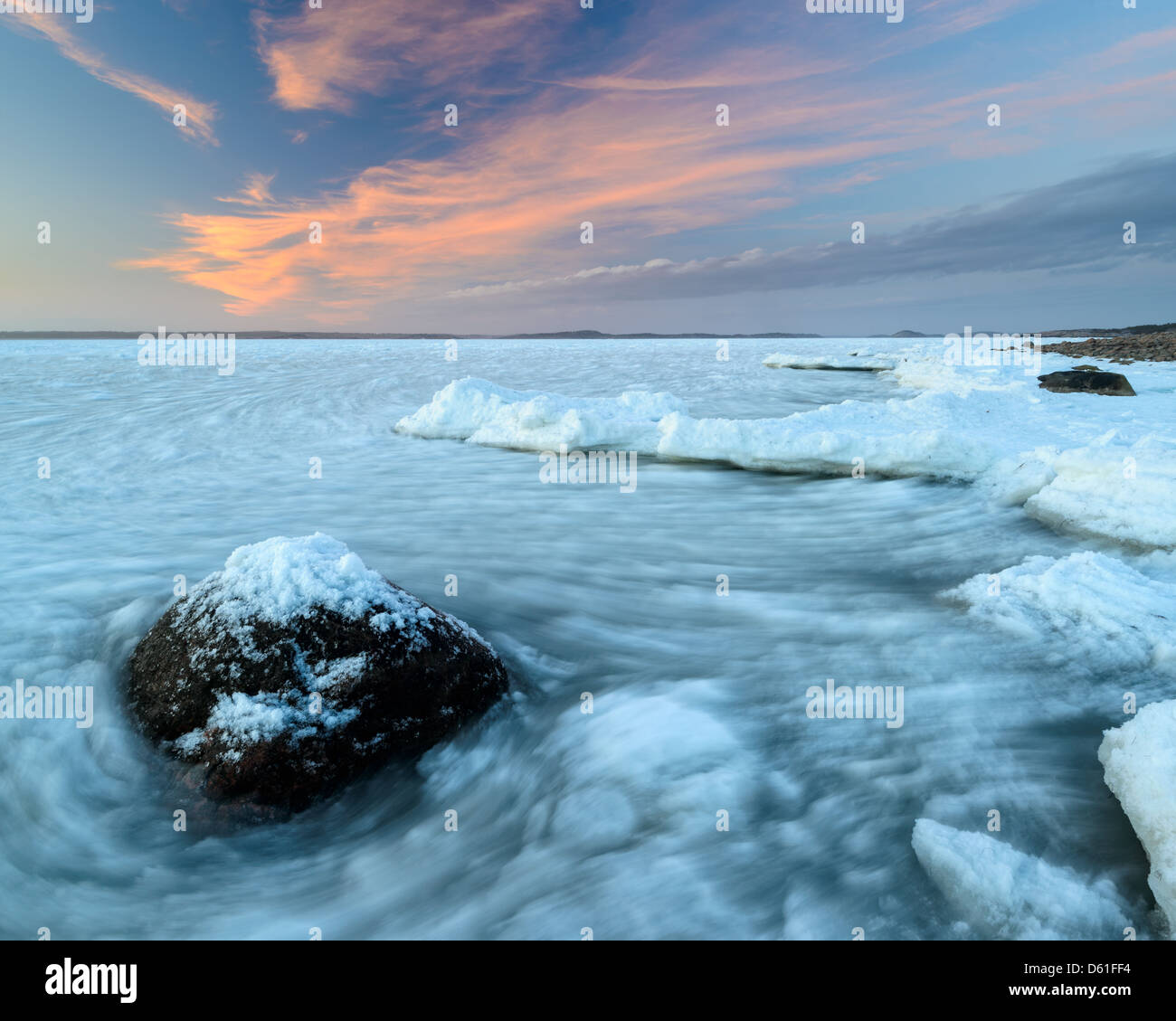Frozen shore along the coast of Näsbokrok Nature reserve at sunset, Halland, Sweden, Europe Stock Photo