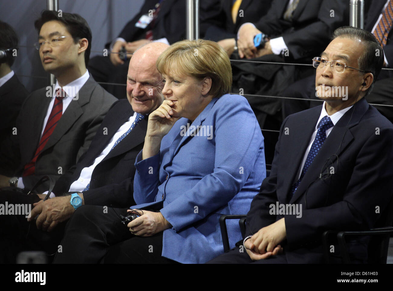 (L to R:) German Economy Minister Philipp Roesler, Volkswagen Group Chairman Ferdinand Piech, German Chancellor Angela Merkel and Chinese Prime Minister Wen Jiabao visit the Volkswagen plant in Wolfsburg, Germany, 23 April 2012.  Photo: KAY NIETFELD Stock Photo