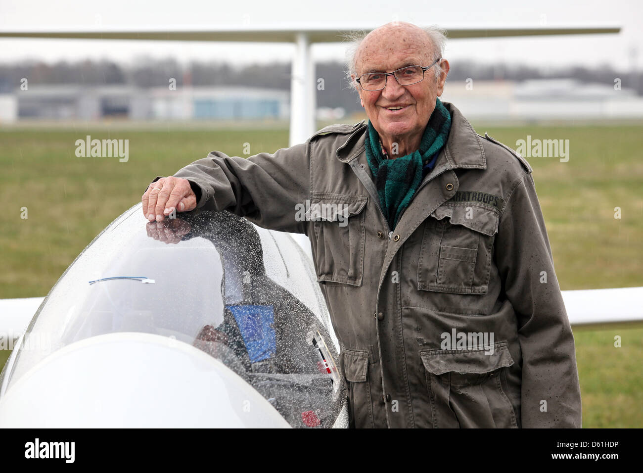 Glider pilot Hans-Werner Grosse stands next to his glider "eta" at the air  field in Luebeck, Germany, 24 April 2012. To this day, the 89 year old  holds a glider record. He