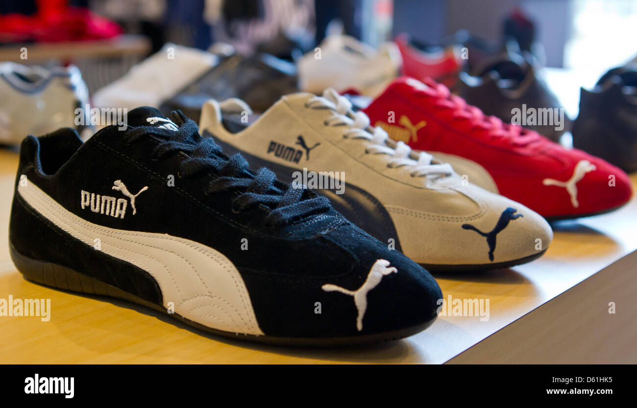 Shoes of the sportswear manufacturer Puma are displayed in a store in Herzogenaurach, Germany, 24 April 2012. In 2011, Puma reached the three euro turnover mark for the first time. The