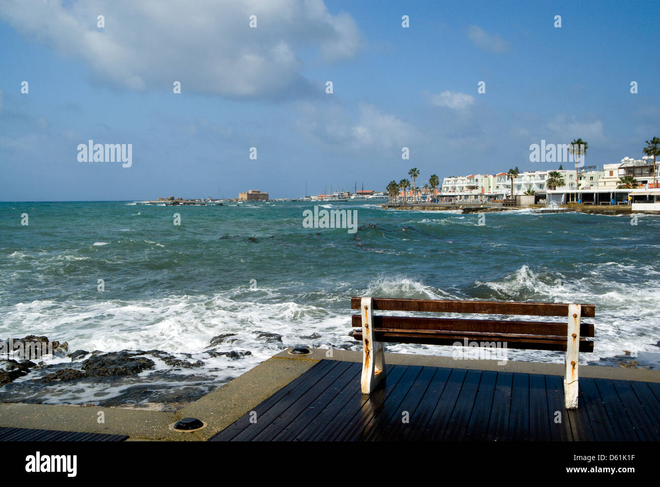 bench and rough sea, paphos, cyprus Stock Photo