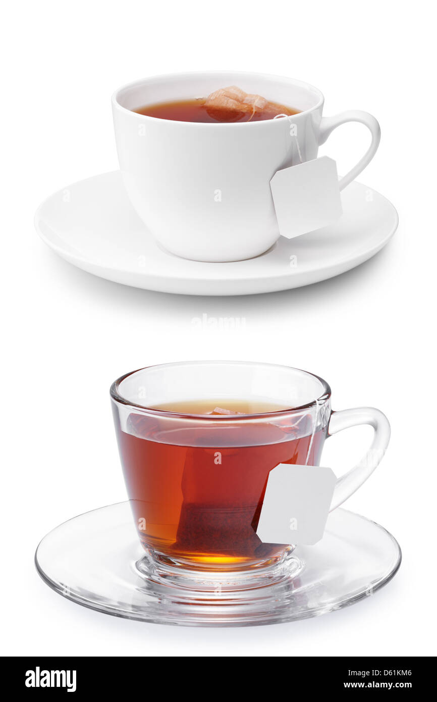 two cups of tea with tea bags and blank labels isolated on white Stock