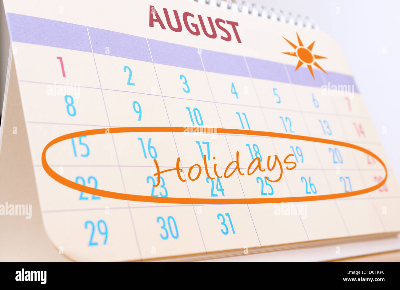 Desktop calendar showing August month with highlighted planned summer holidays Stock Photo