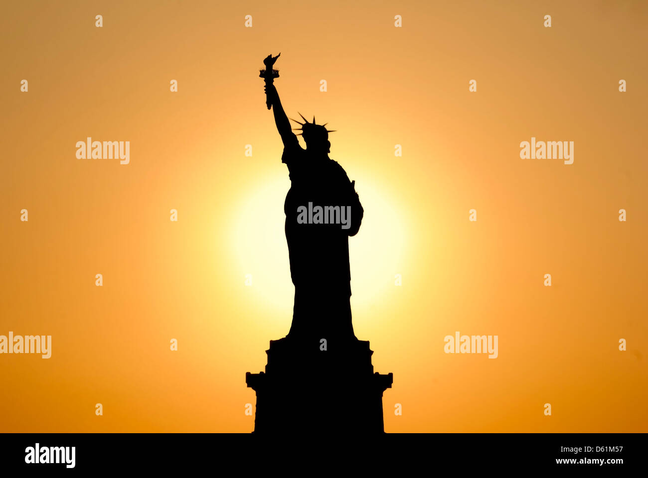 Silhouette of the Statue of Liberty in the sunset, Liberty Island, New ...