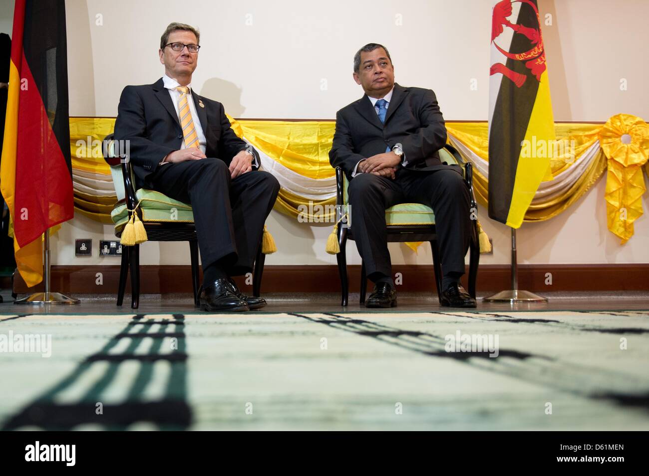 German Foreign Minister Guido Westerwelle (FDP, L) sits next to Bruneiean Minister for Energy Pehin Dato Haji Mohammad Yasmin at Jerudong Park Medical Center in Bandar Seri Begawan, Brunei, 26 April 2012. Westerwelle will be in Brunei until 27 April 2012. Photo: SEBASTIAN KAHNERT Stock Photo