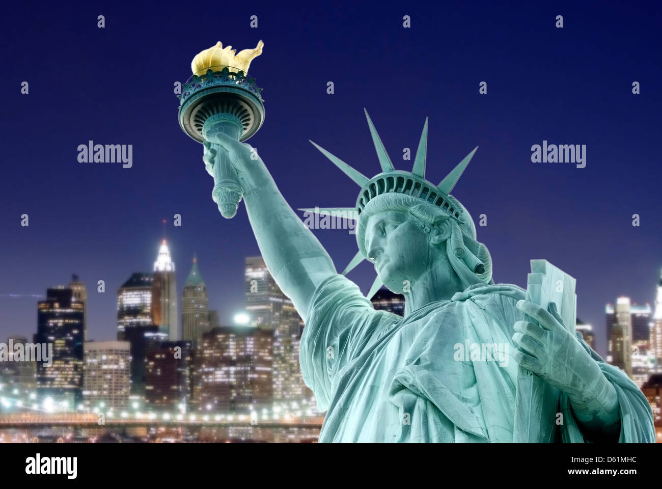 Statue of Liberty with skyline of New York at night, New York City, New ...