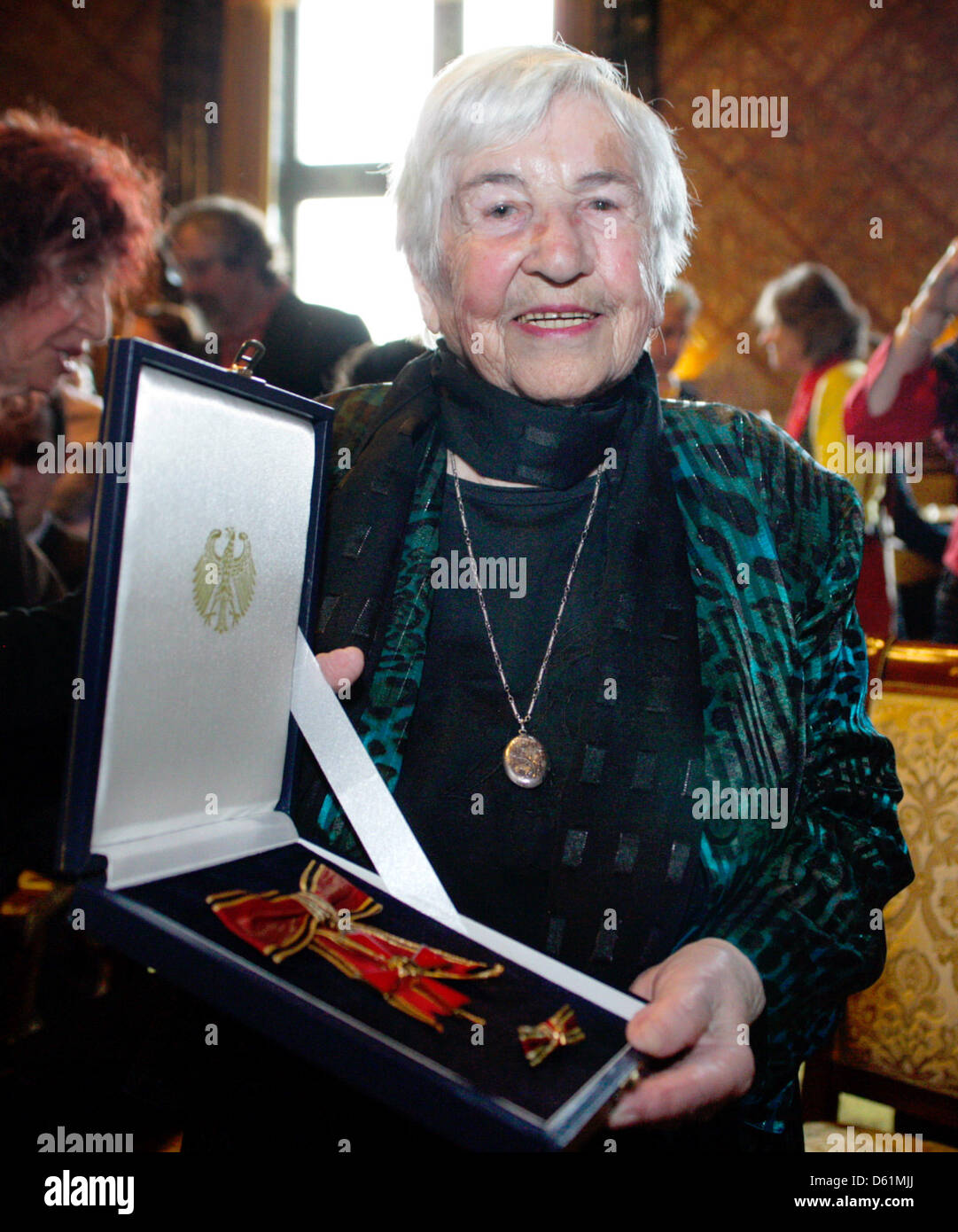 Esther Bejarano is pictured with her Great Federal Cross of Merit at the city hall in Hamburg, Germany, 26 April 2012. Mayor of Hamburg Olaf Scholz awarded her the Great Federal Cross of Merit. Bejarano is one of the last survivors of the girls' orchestra of Auschwitz. Photo: DANIEL BOCKWOLDT Stock Photo