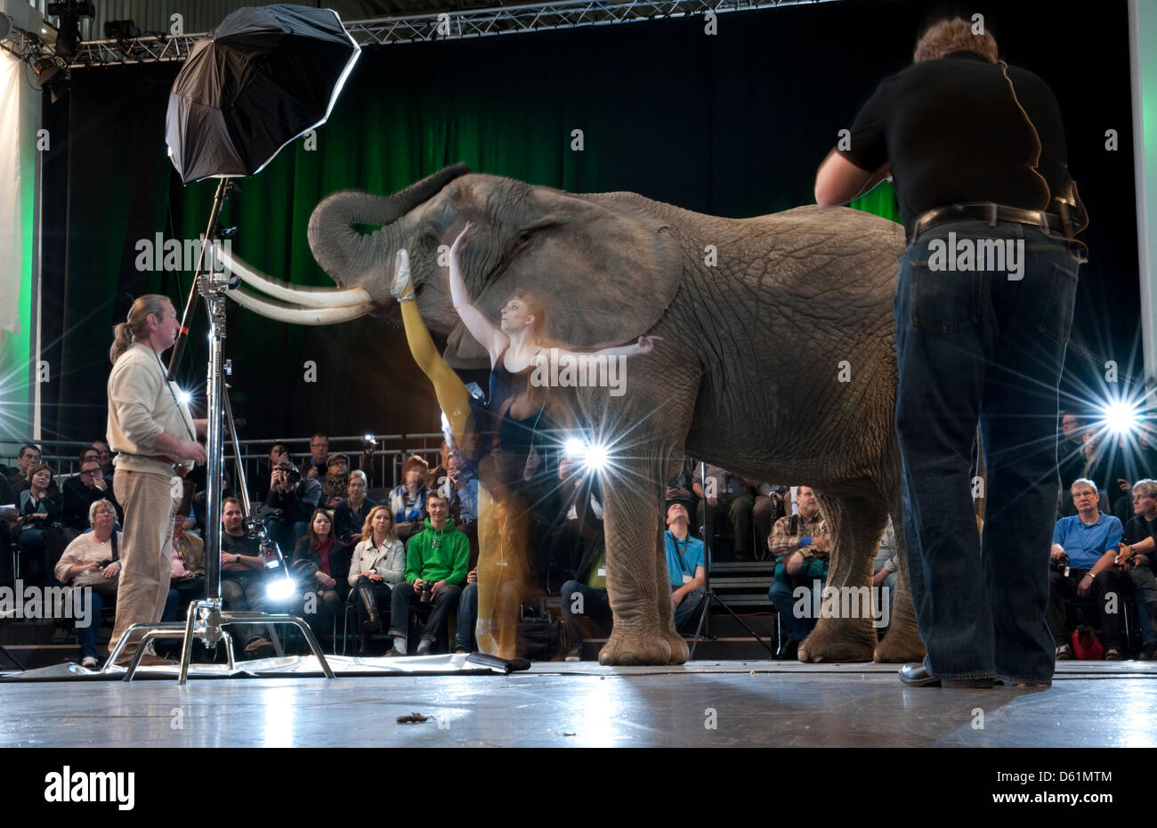 US National Geographic photographer Joe McNally (R) takes a picture of
