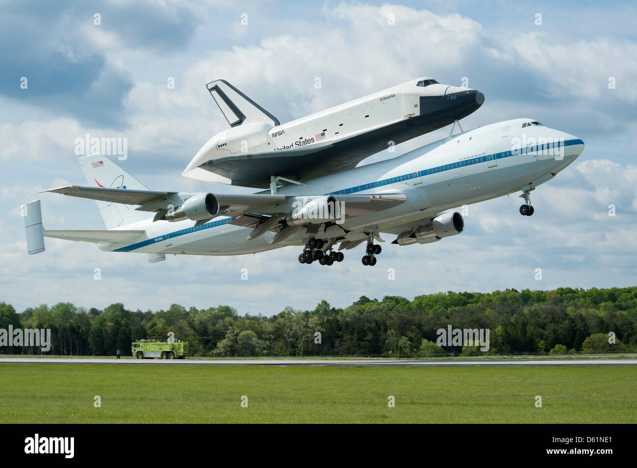 Space shuttle Enterprise, mounted atop a NASA 747 Shuttle Carrier Aircraft (SCA), is seen as it takes off for New York from Washington Dulles International Airport, Friday, April 27, 2012, in Sterling, Virginia. Enterprise was the first shuttle orbiter built for NASA performing test flights in the atmosphere and was incapable of spaceflight. Originally housed at the Smithsonian's S Stock Photo