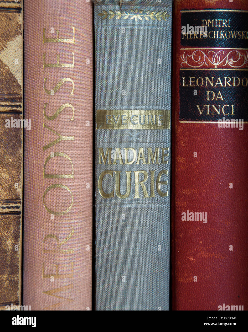 A close up shot of some old books from Homer, Madam Curie, and Leonardo Da Vinci. Alte Bücher. Stock Photo