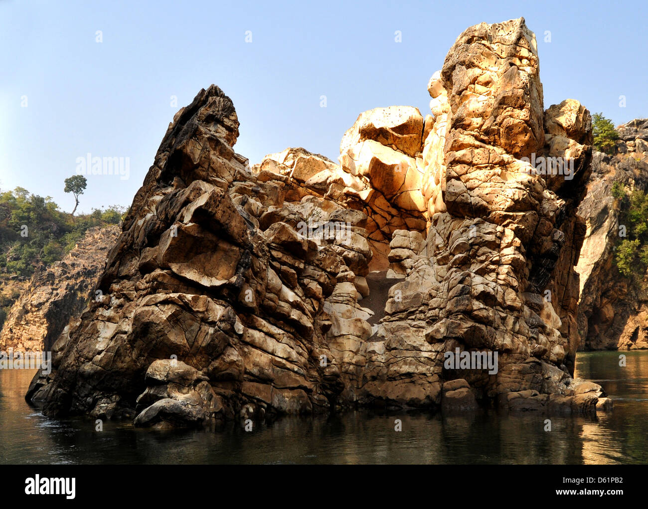 River Narmada flows through a canyon or gorge of Marble rocks in Bhedaghat in Jabalpur district of Indian Madhya Pradesh state Stock Photo