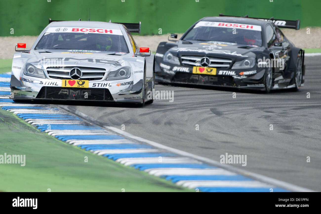 British Mercedes race driver Jamie Green (L) drives in front of British ...
