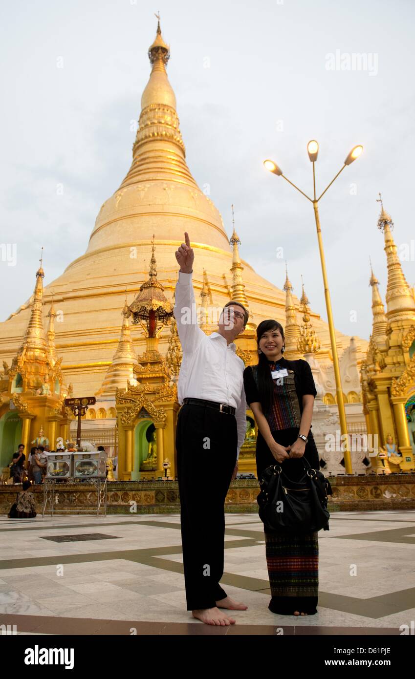 German Foreign Minister Guido Westerwelle visits the Shwedagon Pagoda with a memeber of the German embassy in Yangon, Myanmar, 29 April 2012. Reports state that Westerwelle is currently touring several Asian countries. Photo: SEBASTIAN KAHNERT Stock Photo