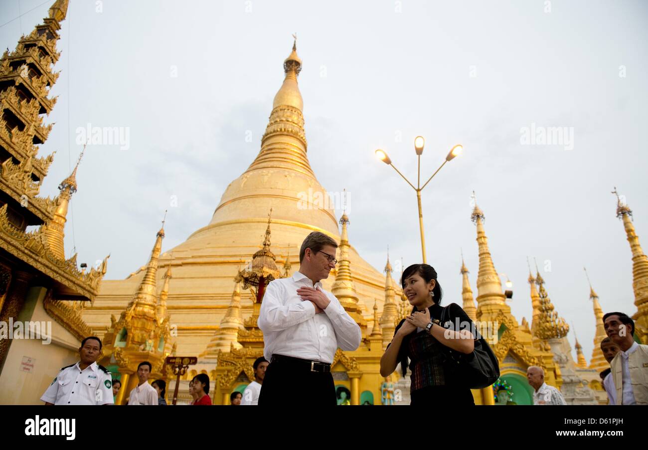 German Foreign Minister Guido Westerwelle visits the Shwedagon Pagoda with a memeber of the German embassy in Yangon, Myanmar, 29 April 2012. Reports state that Westerwelle is currently touring several Asian countries. Photo: SEBASTIAN KAHNERT Stock Photo