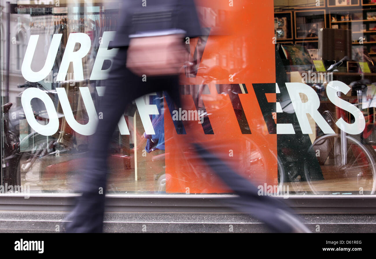 A passerby walks past the fashion store 'Urban Outfitters' in downtown