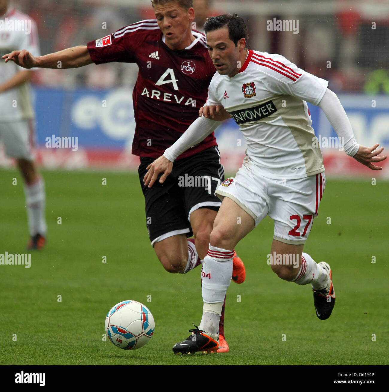 Leverkusen's Gonzalo Castro (R) vies for the ball with Nuremberg's Maik Frantz during the Bundesliga soccer match between 1. FC Nuremberg and Bayer 04 Leverkusen at easyCredit Stadion in Nuremberg, Germany, 05 May 2012. Photo: DANIEL KARMANN  (ATTENTION: EMBARGO CONDITIONS! The DFL permits the further utilisation of the pictures in IPTV, mobile services and other new technologies o Stock Photo