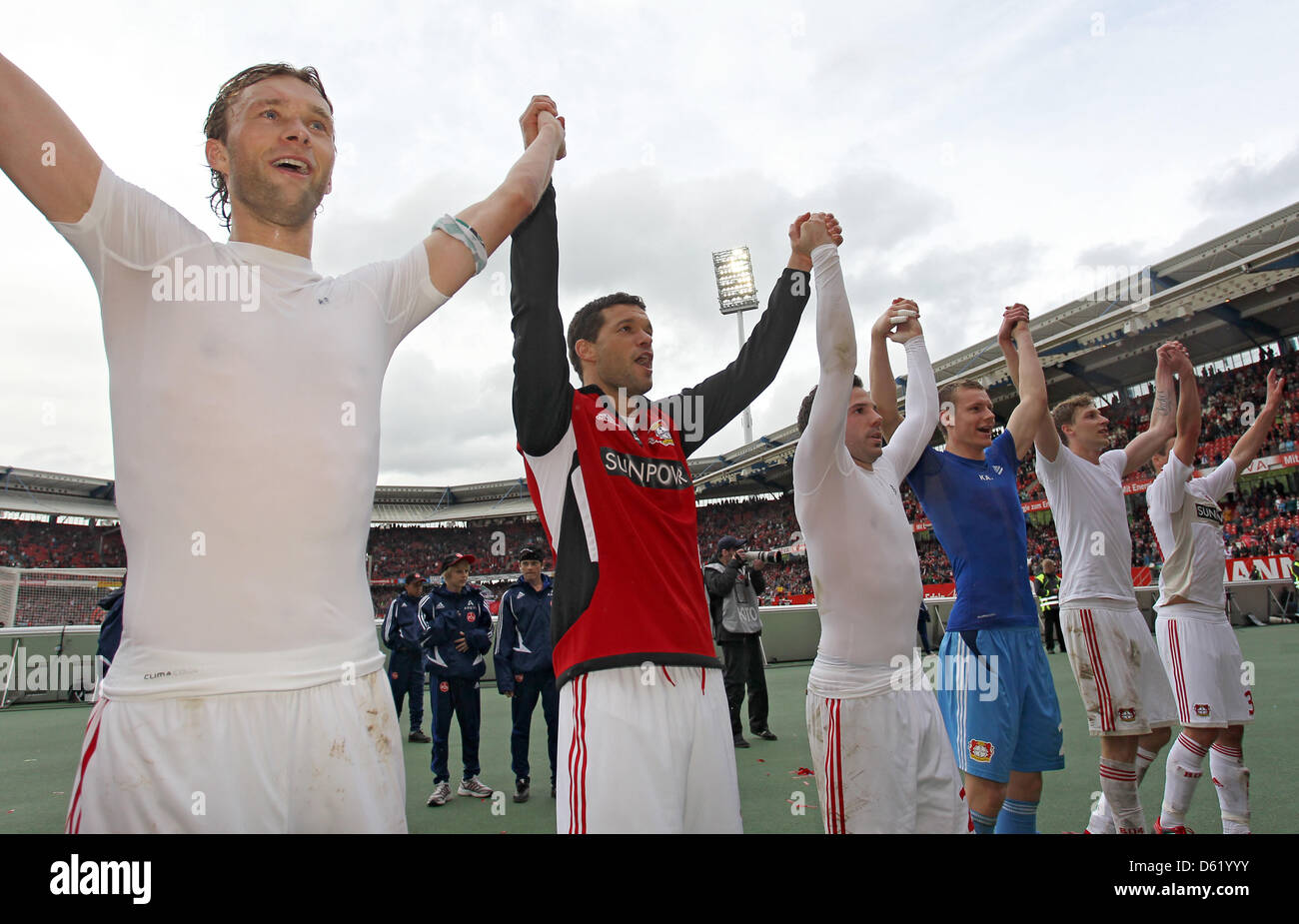 Leverkusen's Simon Rolfes (L-R), Michael Ballack, Gonzalo Castro, Bernd Leno and Stefan Kiessling celebrate with the fans after the Bundesliga soccer match between FC Nuremberg and Bayer 04 Leverkusen at easyCredit Stadion in Nuremberg, Germany, 05 May 2012. The match ended 1-4. Photo: Daniel Karmann Stock Photo