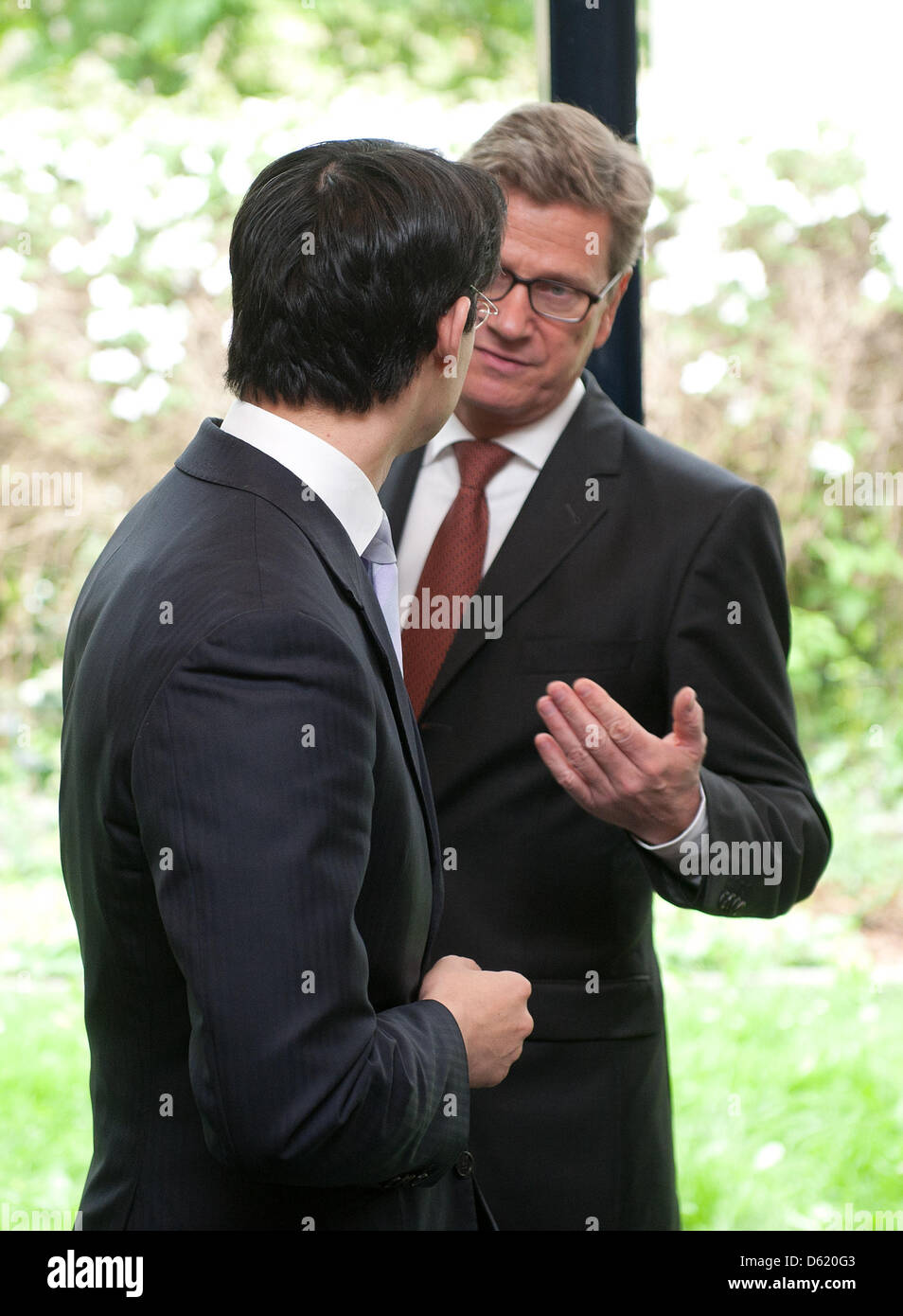 FDP chairman Philipp Roesler (L) and German Foreign Minister Guido Westerwelle meet prior to the committee meeting of the Free Liberals FDP in Berlin, Germany, 07 May 2012. Although FDP lost more than six percent compared to the last election in 2009 the party managed to enter the state parliament. Photo: JOERG CARSTENSEN Stock Photo